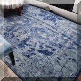 DR12. Handknotted bluw wool rug. Approx. 9' x 12' 